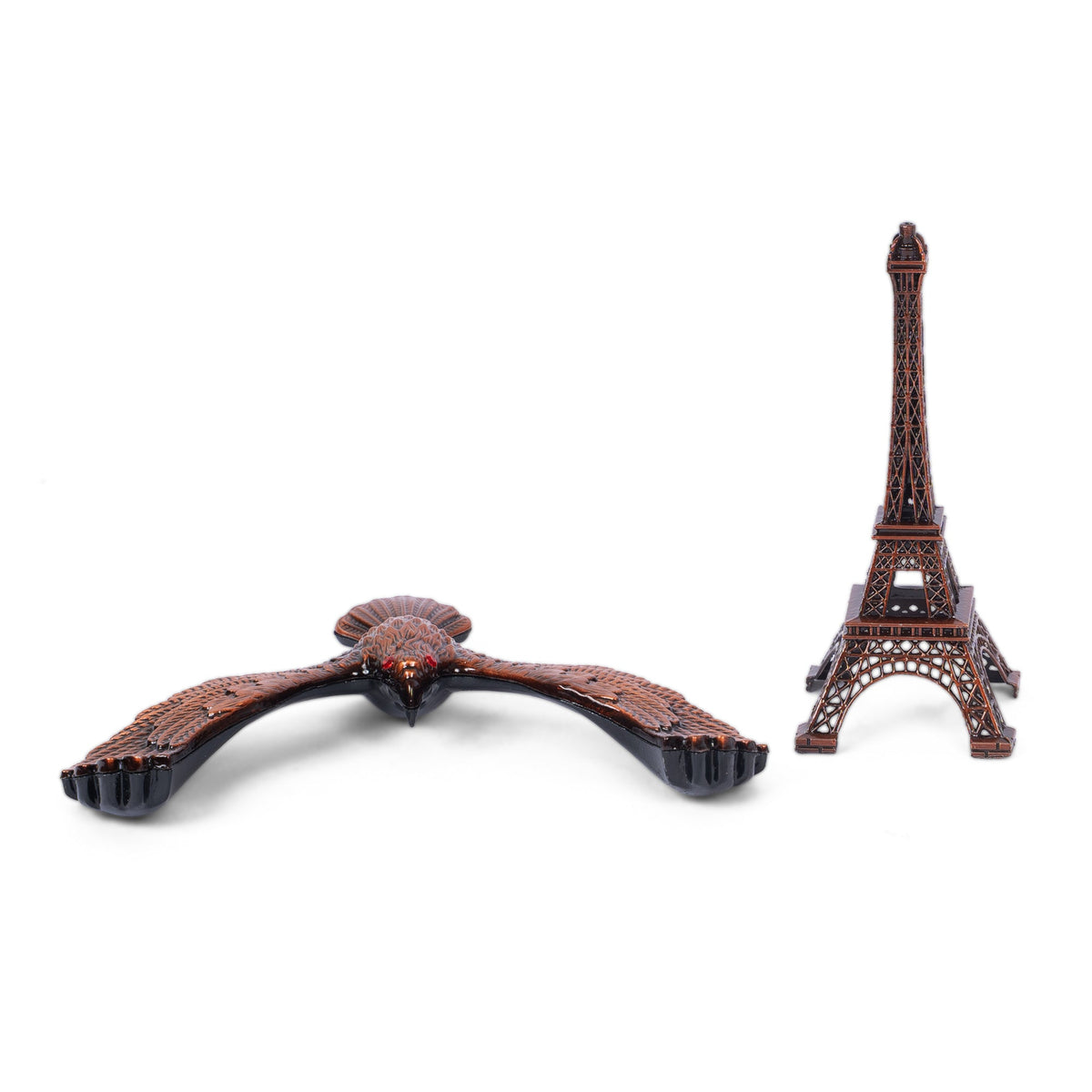 Handcrafted wooden eagle and Eiffel Tower sculpture side view