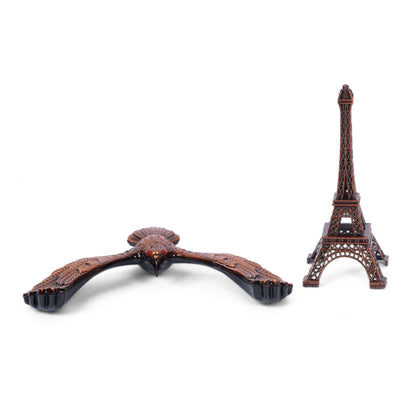Handcrafted wooden eagle and Eiffel Tower sculpture side view
